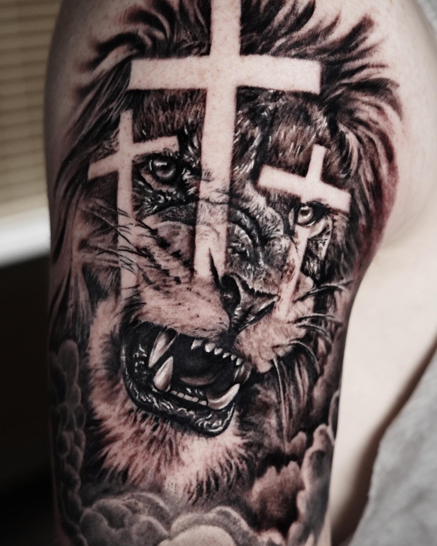 Lion realism tattoo on the forearm by David Gordon
