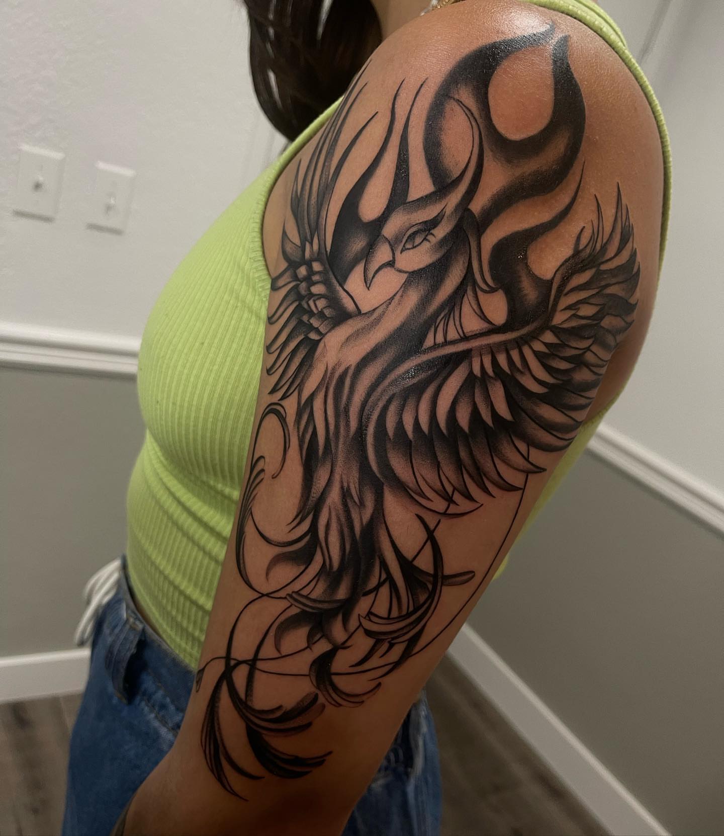 Phoenix black and grey tattoo on the shoulder by Las Vegas Tattoo Artist