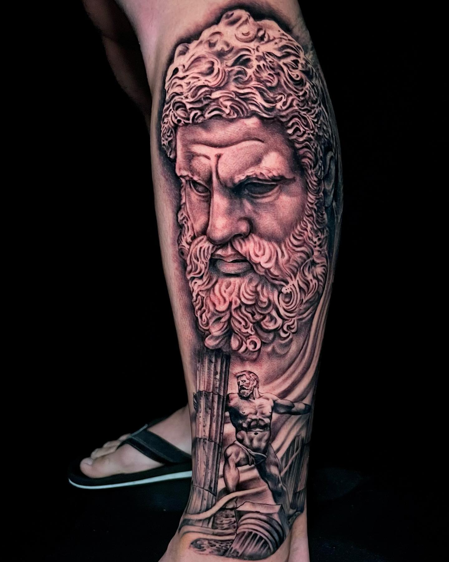 God-like figure realism tattoo on the calf by Alonzo Villa Tattoo