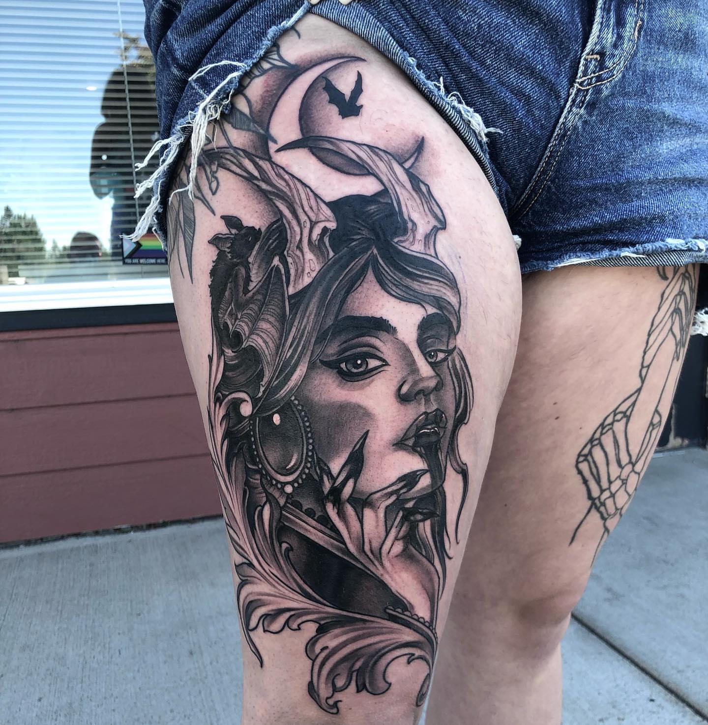 Woman's face realism tattoo on the thigh by Aaron Borden