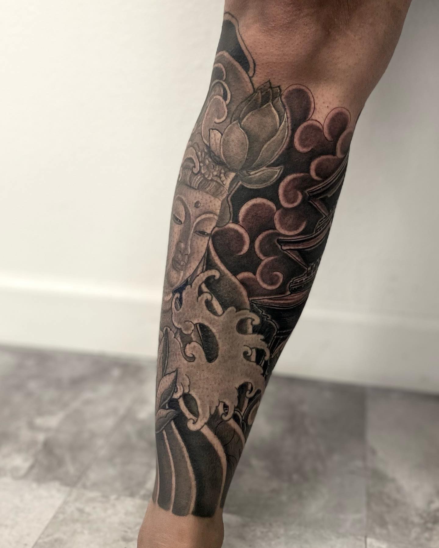 Lotus and Buddha japanese irezumi tattoo on the forearm by Daniel Gutierrez