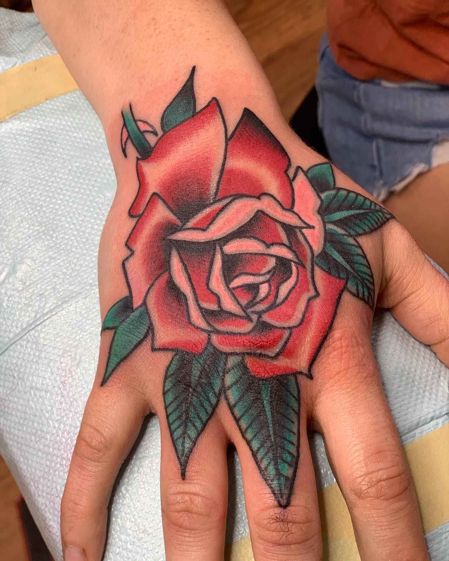 Rose American traditional tattoo on the hand by David Steed, Dallas, Texas