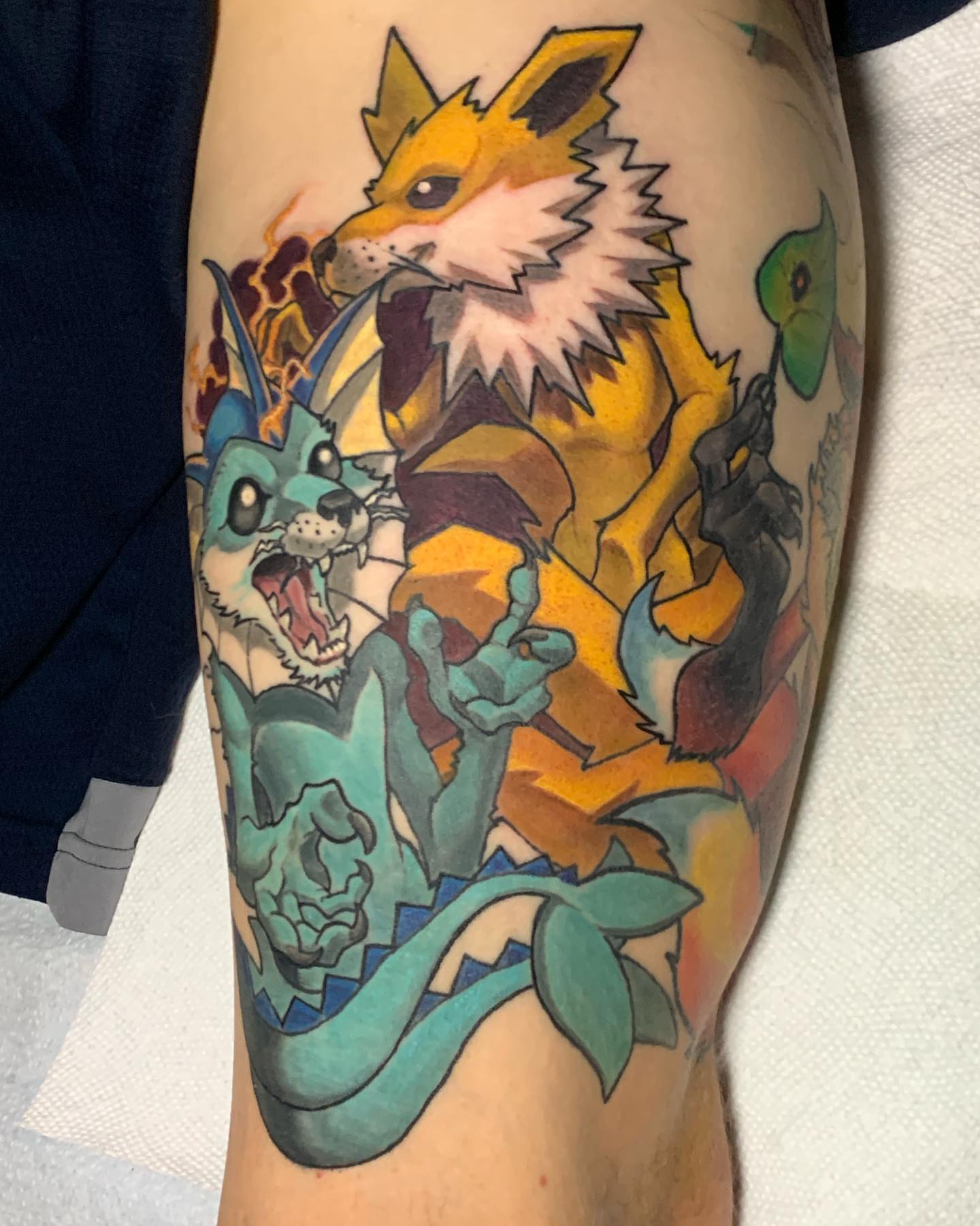 Fox and raccoon American traditional tattoo on the forearm by shane baker