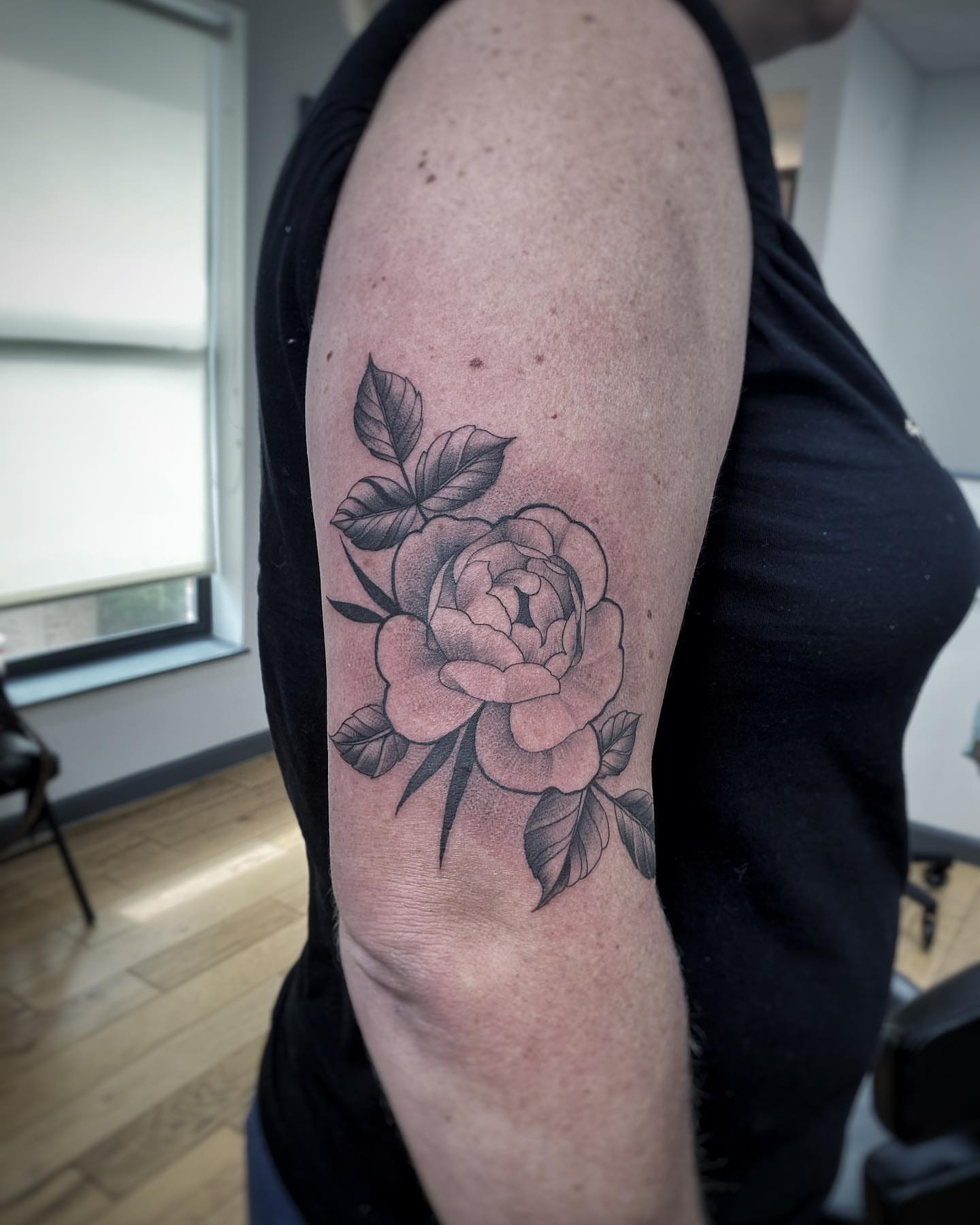 Rose black and grey tattoo on the forearm by David Gray
