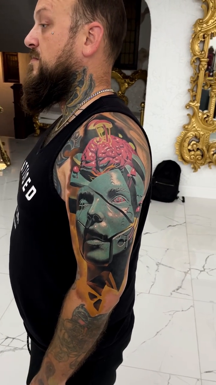 Surreal face with brain realism tattoo by Jacob Sheffield, Grand Junction, Colorado