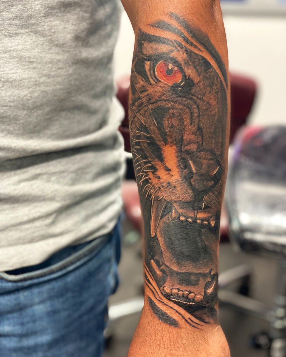 Tiger realism tattoo on the forearm by Alberto Ramirez