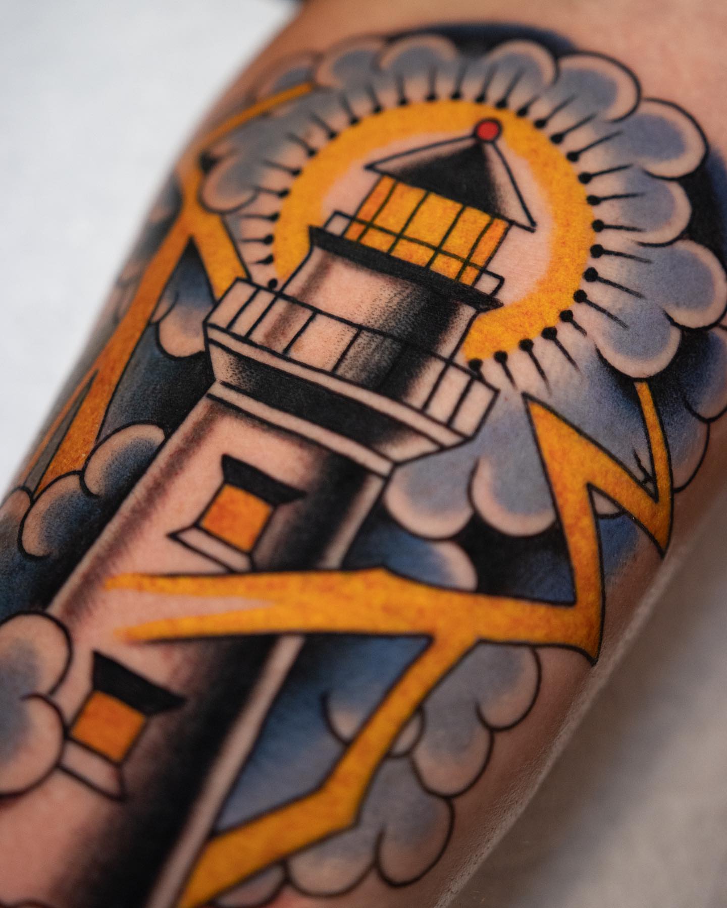 Lighthouse American traditional tattoo on the forearm by Danny Derrick, San Luis Obispo, California