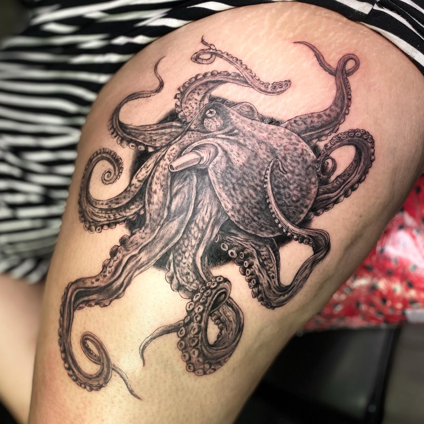 Octopus realism tattoo on the thigh by Sela ✨Las Vegas Tattoo Artist