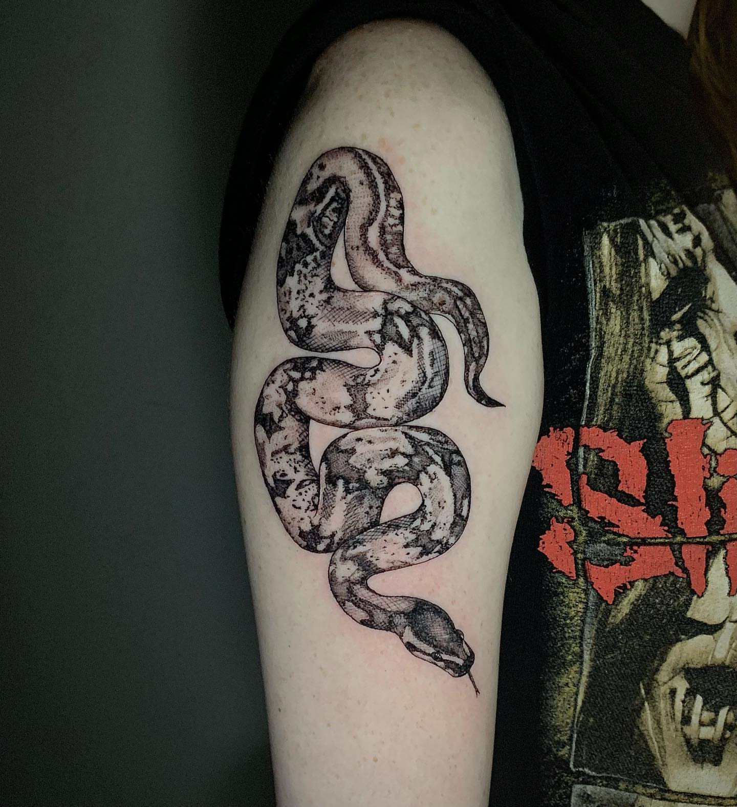 Snake black and grey tattoo on the forearm by Megan McKee Tattoo Artist