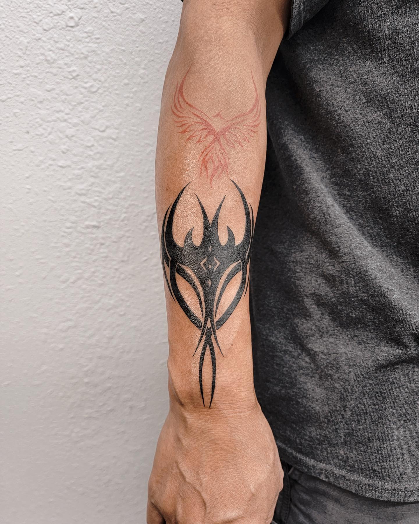 Tribal mask tribal tattoo on the forearm by Houston Tattoo Artist