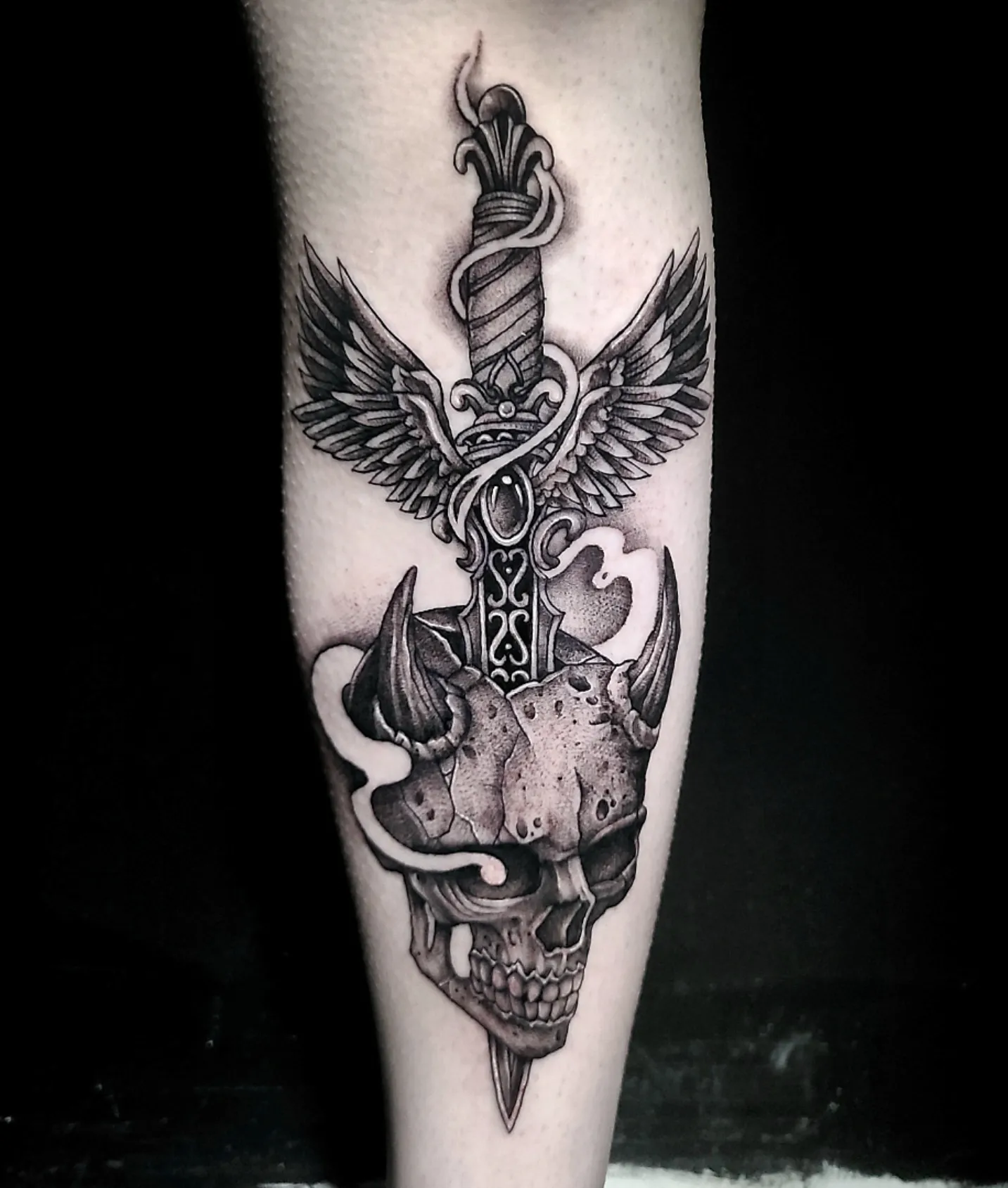 Sword and skull realism tattoo on the forearm by Sydney Paige, Mentor, Ohio