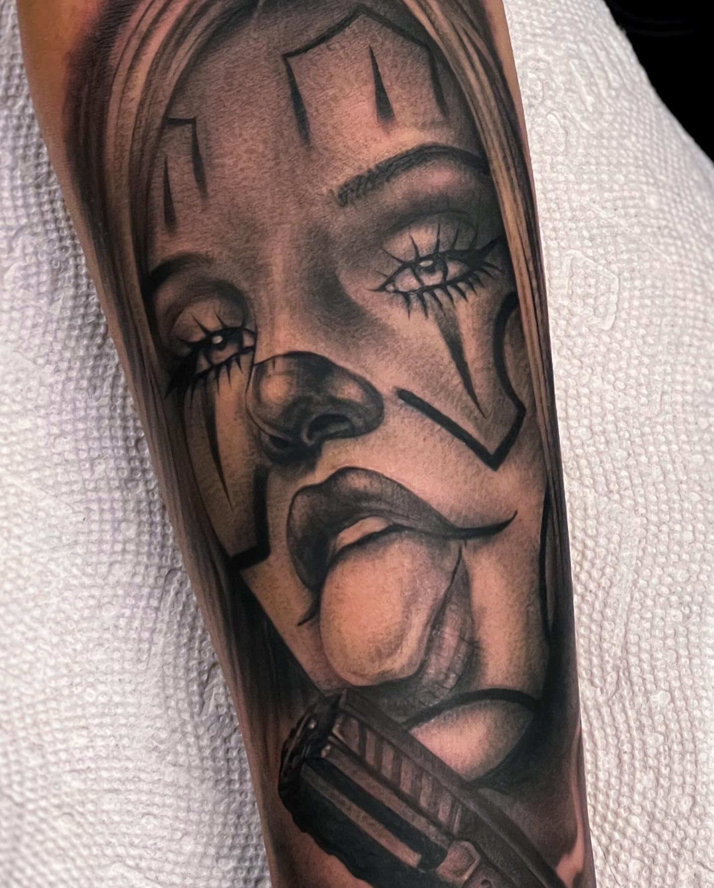 Woman's face realism tattoo on the forearm by Matthew Diaz