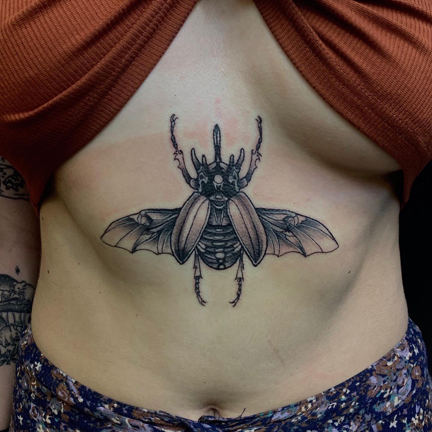 Beetle black and grey tattoo on the ribs by ដេវី  និល - Davi Nil - Tattoo Artist