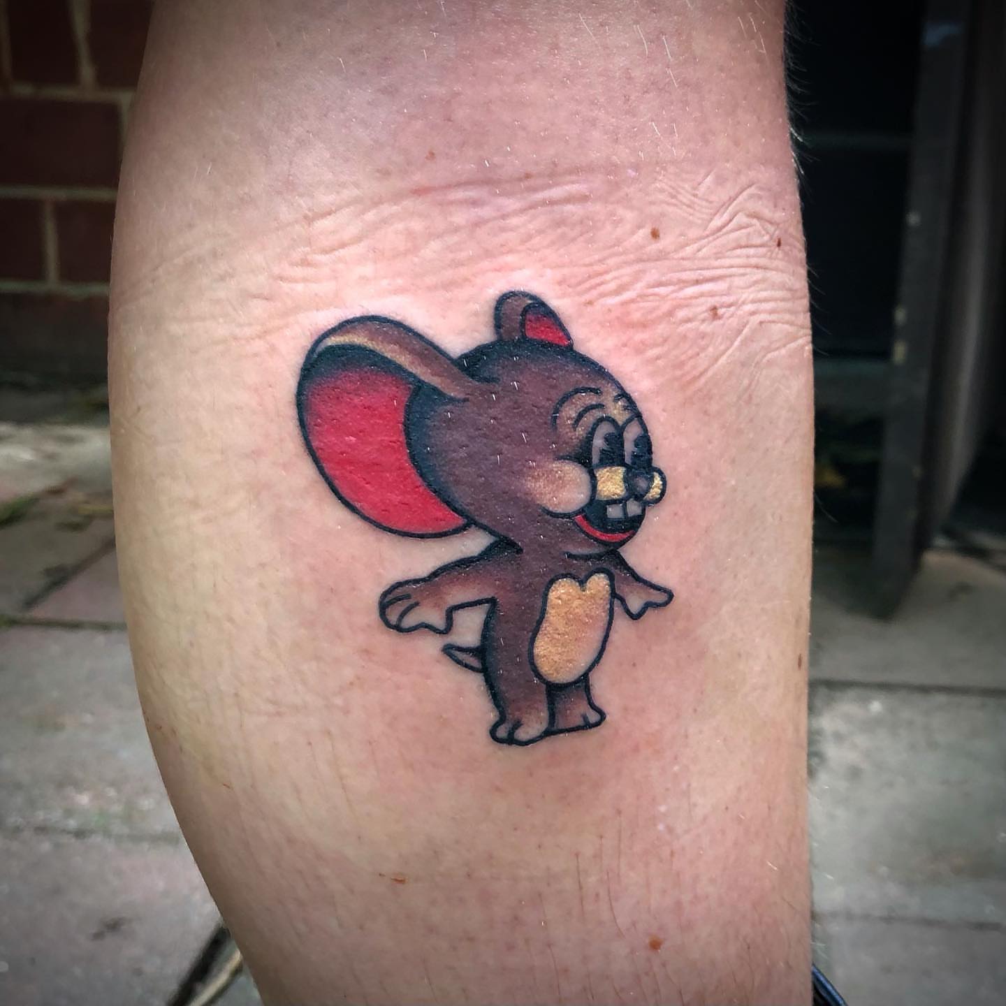 Tom cat American traditional tattoo on the forearm by Paul Trimble