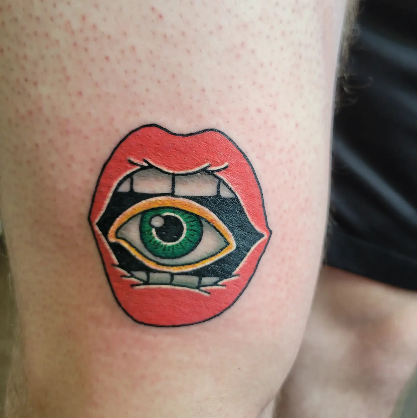 Eye within lips American traditional tattoo on the forearm by Nicole Bett