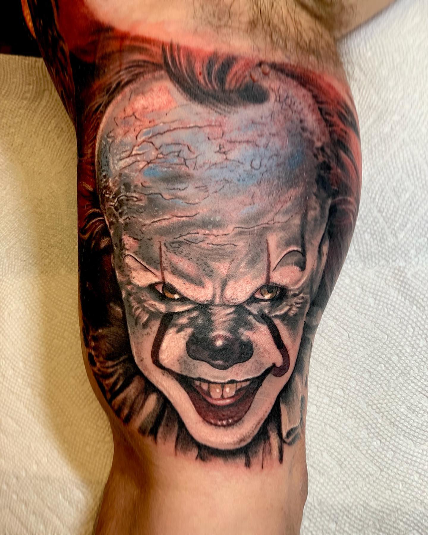 Clown face realism tattoo on the forearm by Brad Sterling