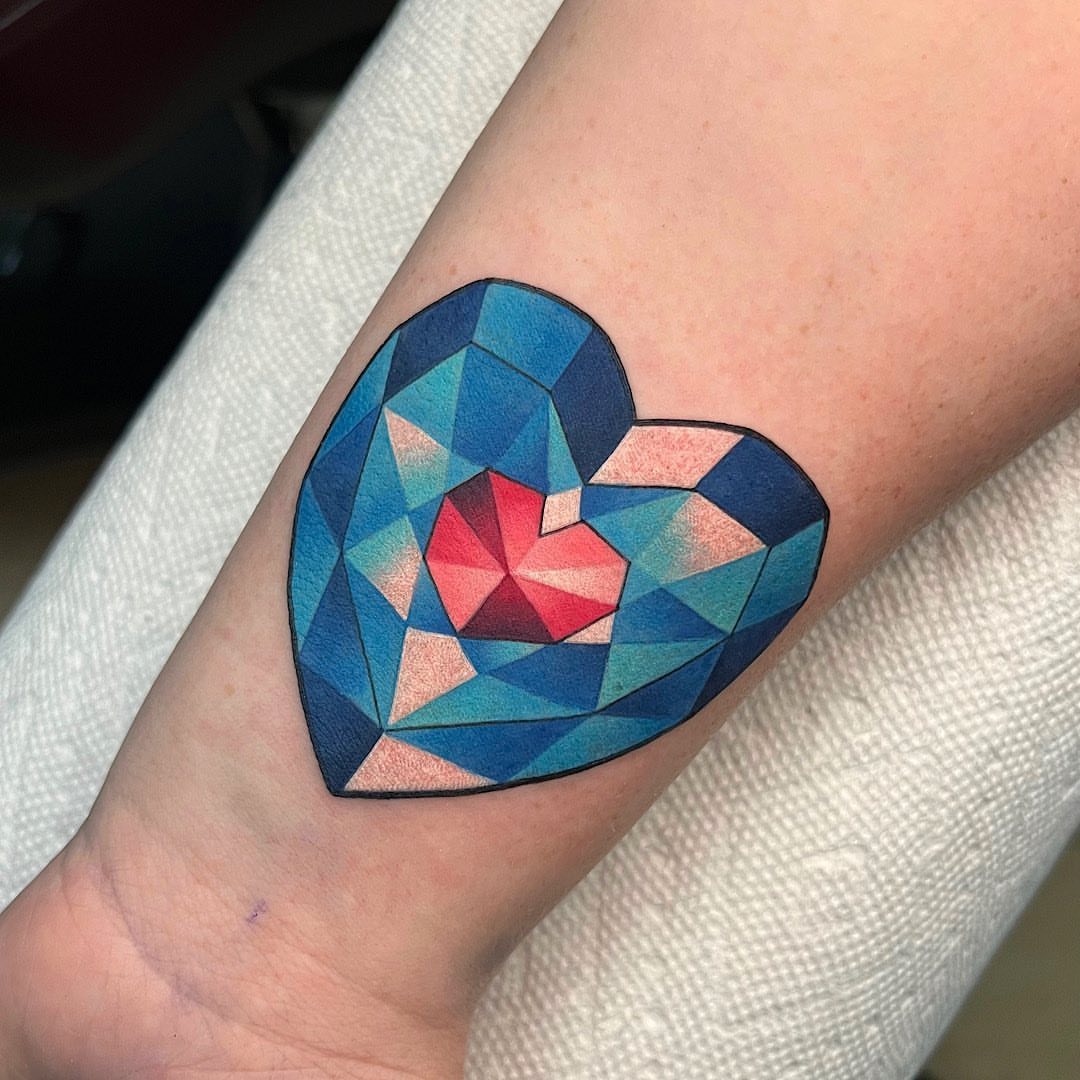 Geometric heart geometric tattoo on the forearm by Shelby Ouellette