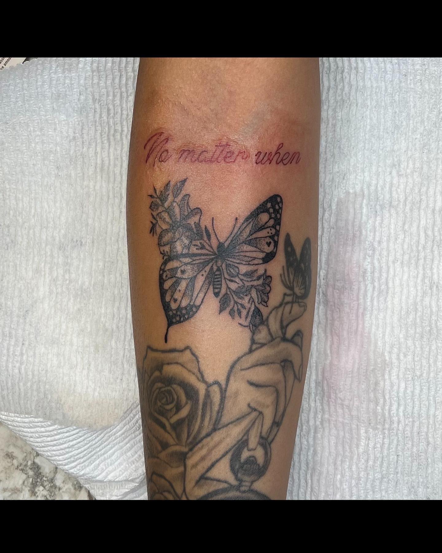Butterfly and roses black and grey tattoo on the forearm by @tattsbyleek