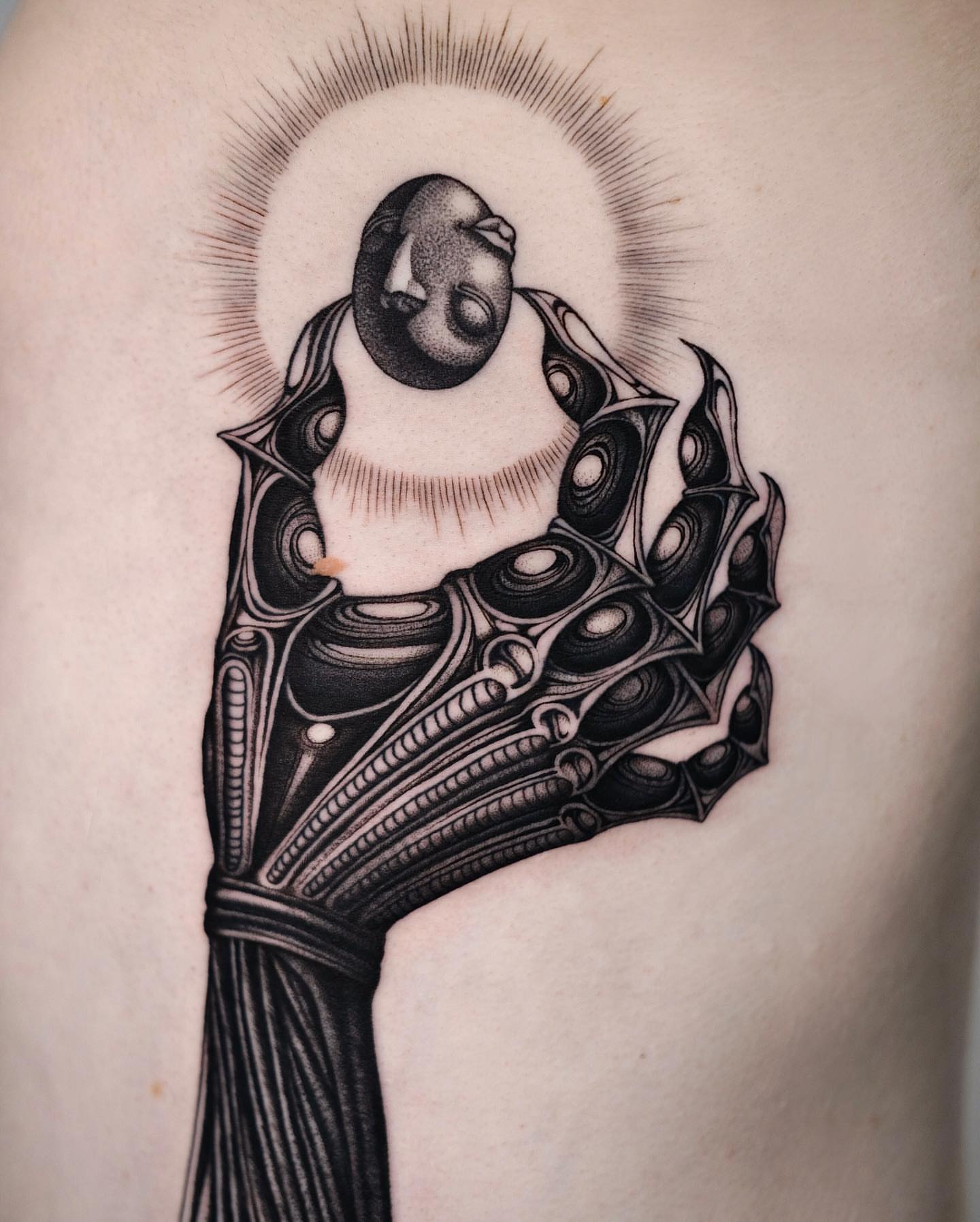 Abstract figure geometric tattoo on the shoulder by Monkey Bob Tattoo