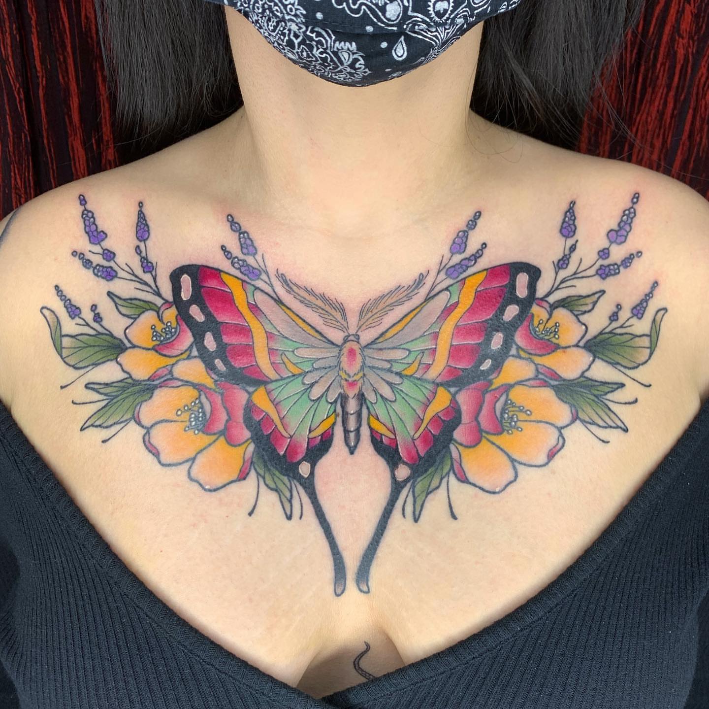 Butterfly and flowers new school tattoo on the chest by Luis Torres, Harrison, New Jersey