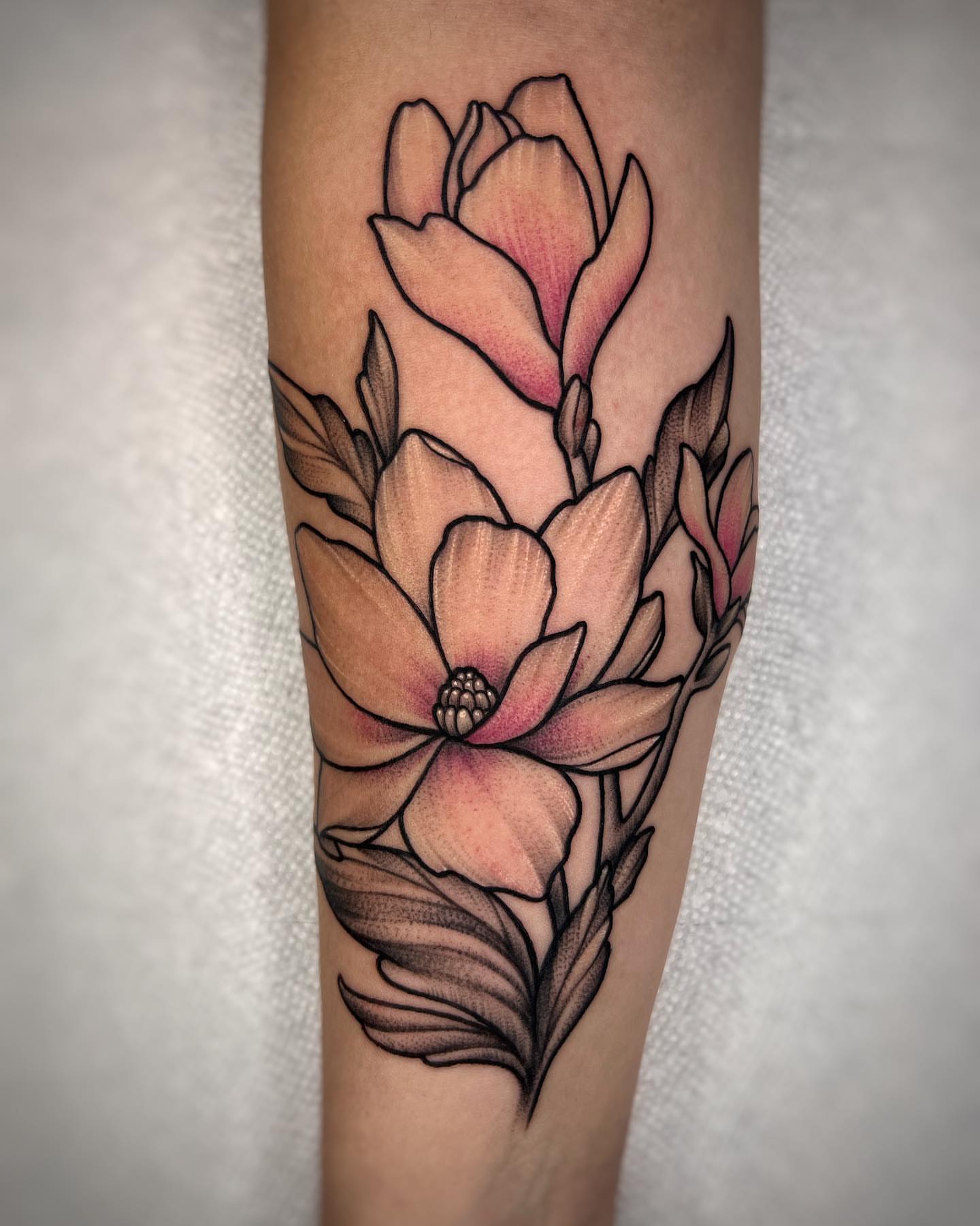 Magnolia flowers black and grey tattoo on the forearm by Tattoos by Hanna, Farmington Hills, Michigan
