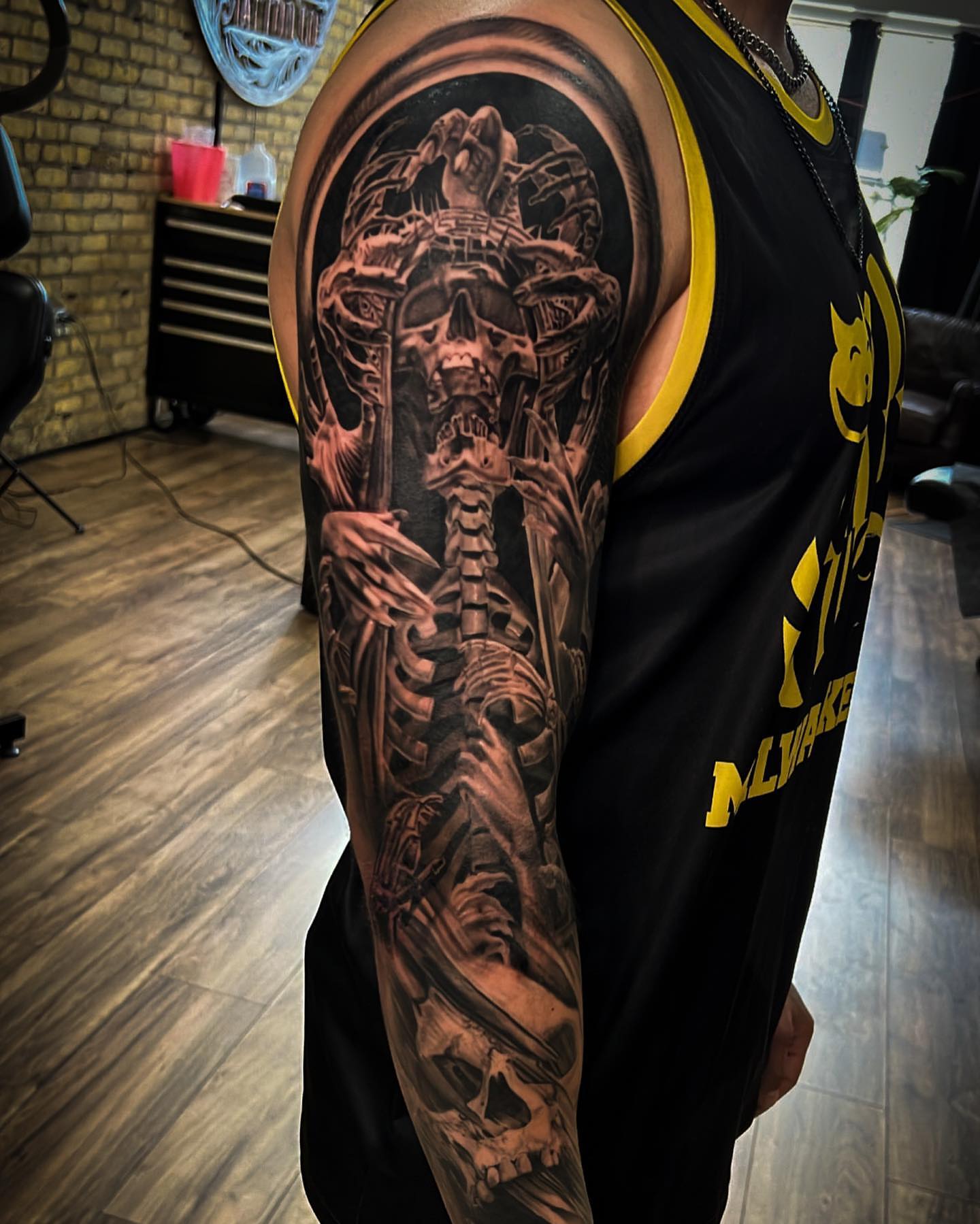 Skeleton realism tattoo on the upper arm by Aaron, Milwaukee, Wisconsin