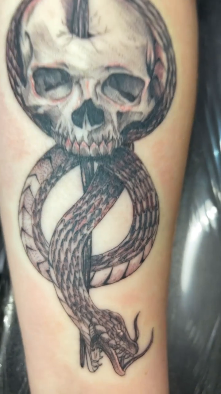 Skull and snake dark realism tattoo by Zachary Kaufhold