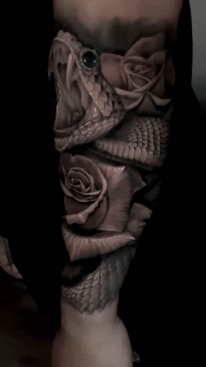 Snake and roses realism tattoo by Sean Flood