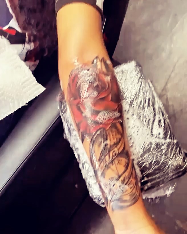 Rose American traditional tattoo on the forearm by Rell Washington, Marlow Heights, Maryland