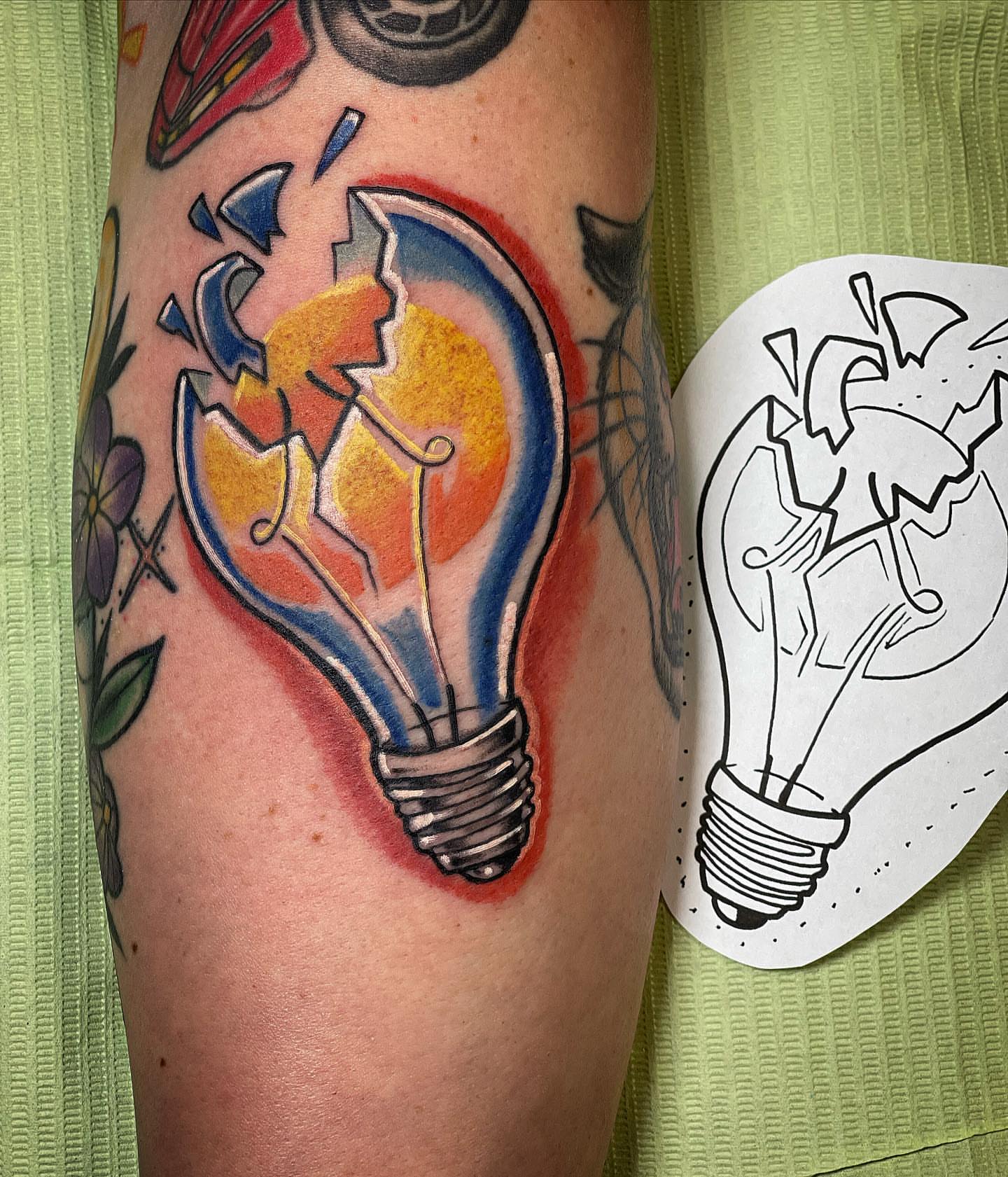 Broken light bulb realism tattoo on the forearm by Sarah Bobby, Houston, Texas