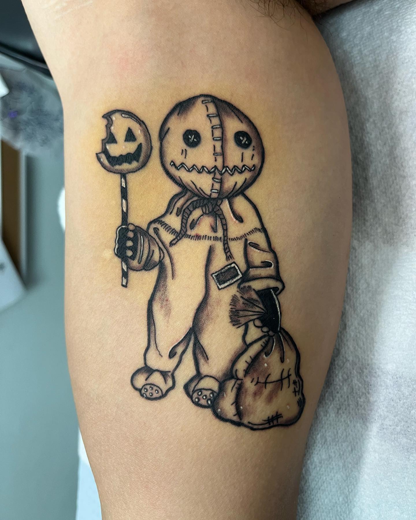 Saw black and grey tattoo on the thigh by Edward A. Boesch