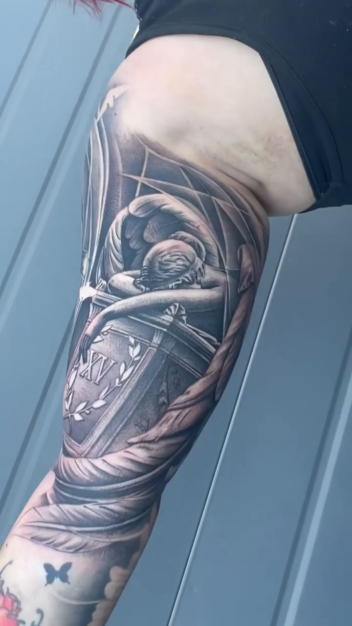 Angel and urn realism tattoo by Kyle Lopez, Union City, California