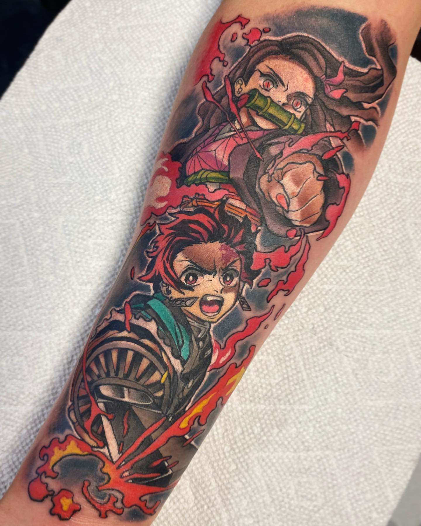 Anime characters anime tattoo on the forearm by Seth Mullin, Hemet, California