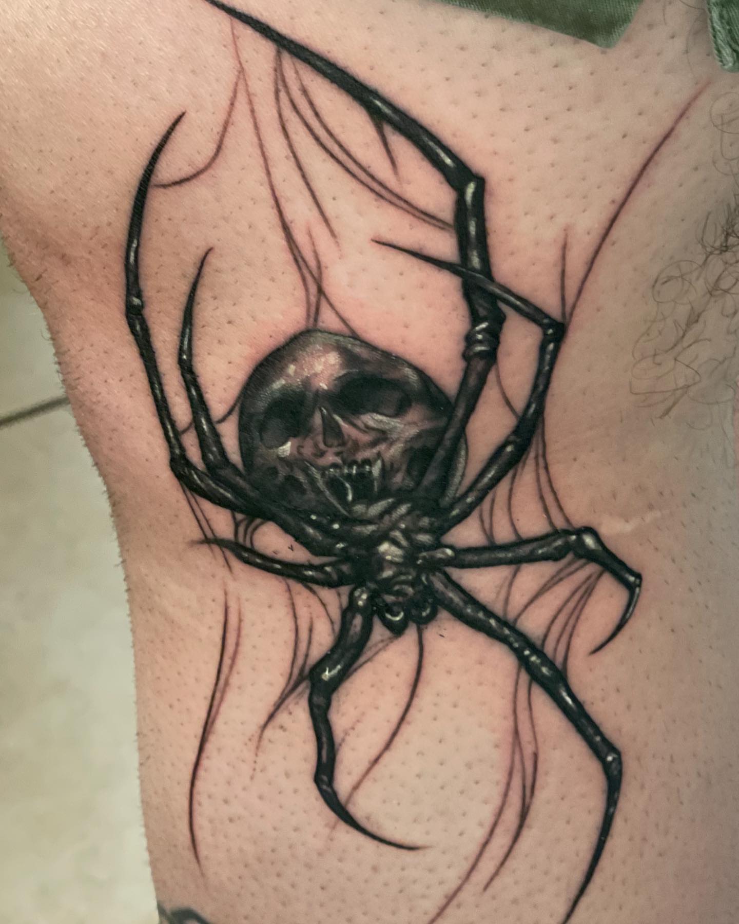 Spider dark realism tattoo on the thigh by 𝕭𝖗𝖞𝖈𝖊 𝖂𝖎𝖑𝖑𝖎𝖆𝖒