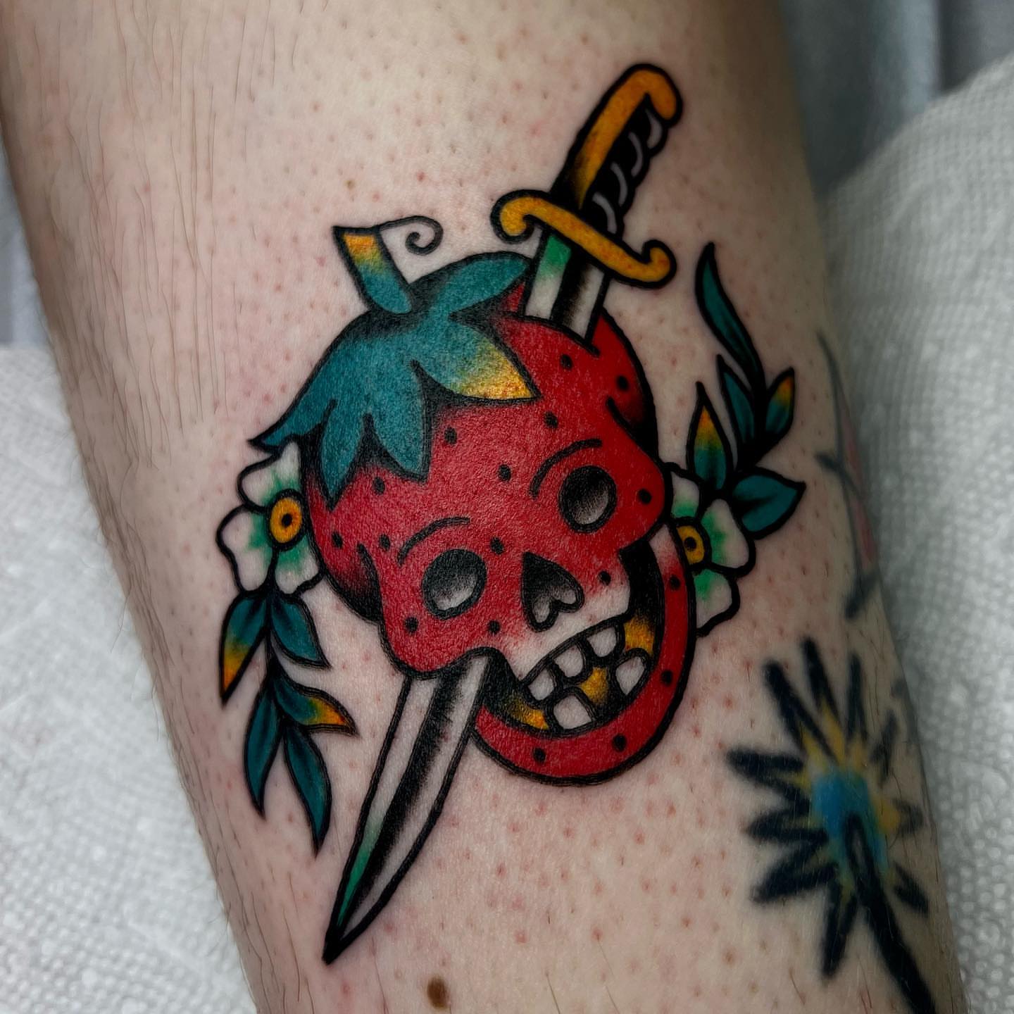 Strawberry skull American traditional tattoo on the forearm by 🍓miranda joon bradbury🍓