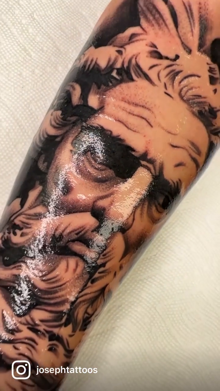 Greek god portrait realism tattoo by Joseph Alvarado