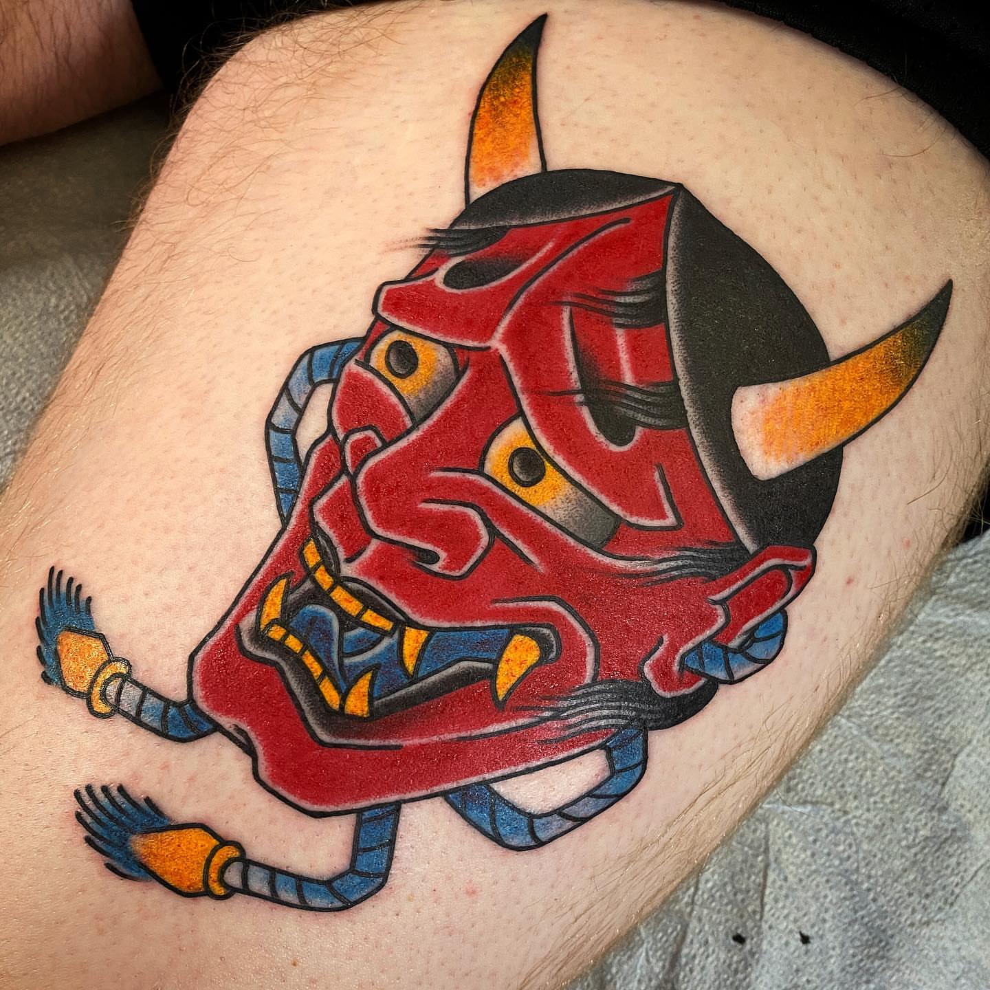 Mask japanese irezumi tattoo on the thigh by Erick Lynch, Cambridge, Massachusetts