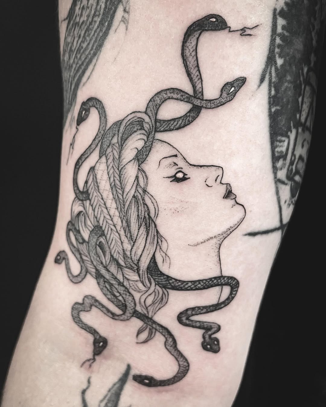 Medusa head with snakes realism tattoo on the forearm by Thylacine Tattoo & Art, Los Angeles, California