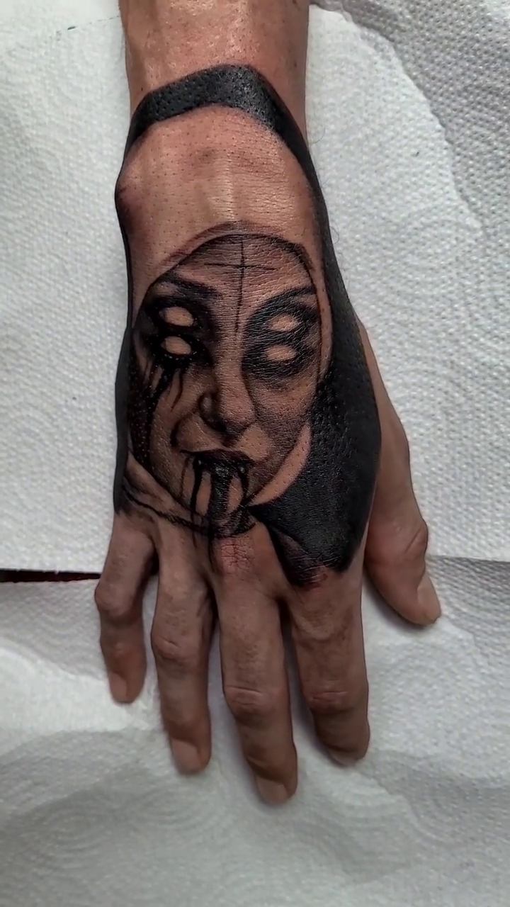 Haunting face with dripping eyes dark realism tattoo by Dan Redding