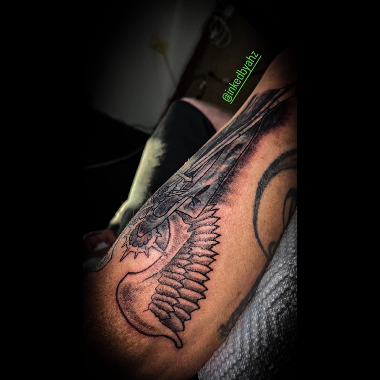 Dragon black and grey tattoo on the forearm by Traveling Tattoo Artist π