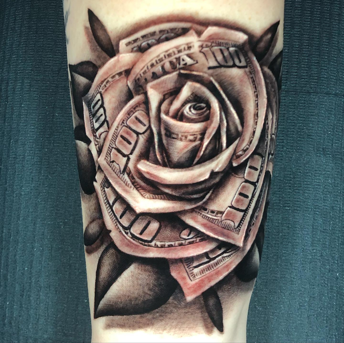 Dollar bill rose realism tattoo on the forearm by Raw Hound, Hialeah, Florida