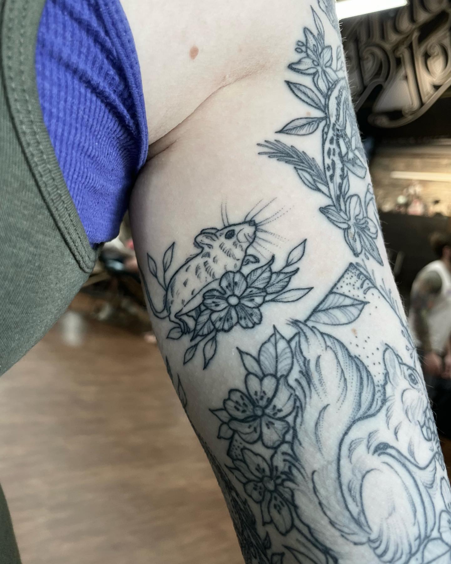 Mouse and flowers black and grey tattoo on the forearm by Kirsten Marsden Ballantyne