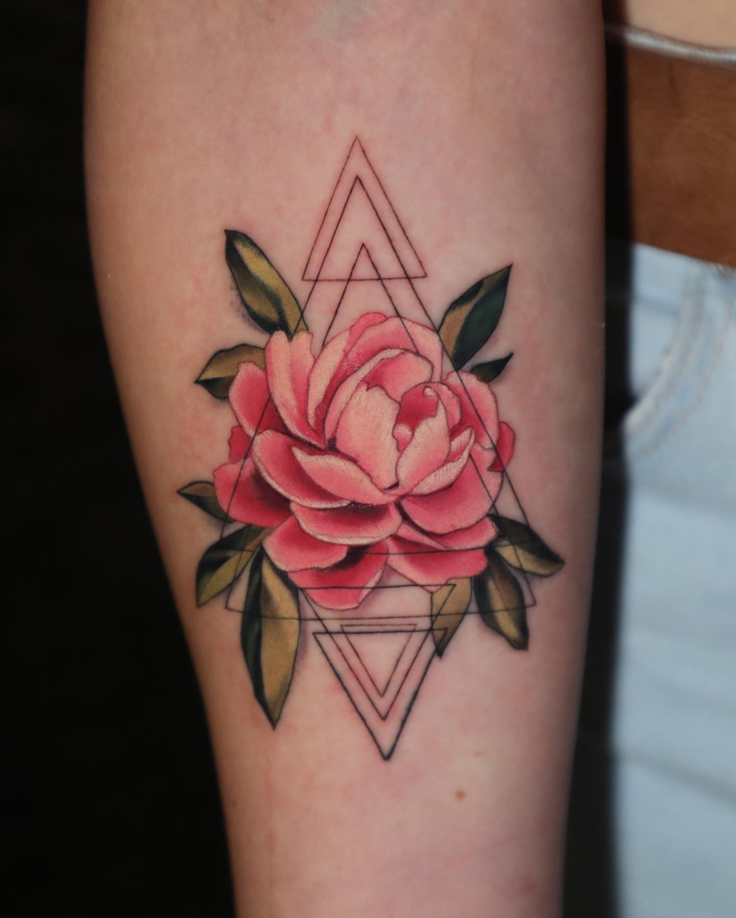 Rose and geometric shapes geometric tattoo on the forearm by Diego Romay