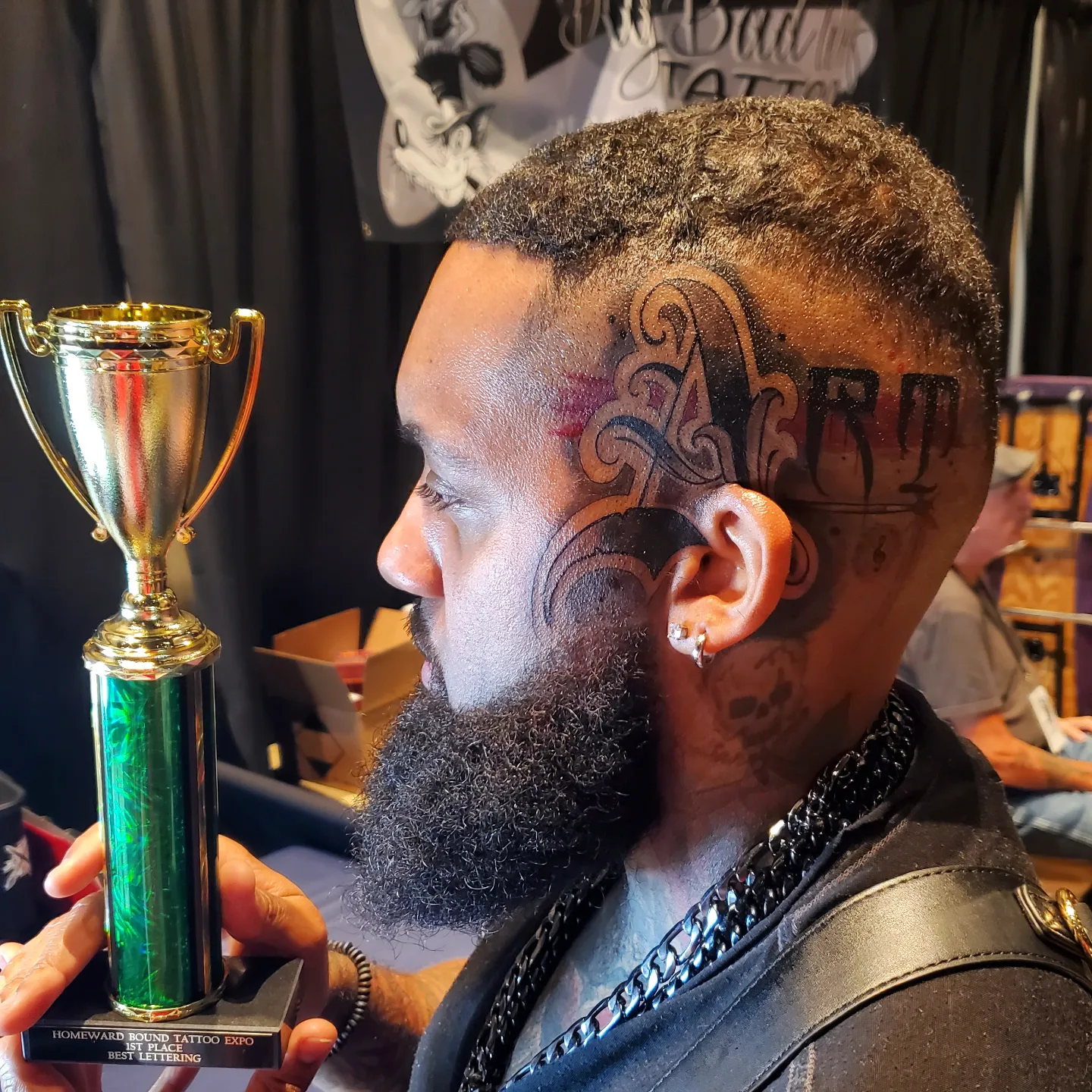 Lettering lettering script tattoo on the head by Chris TL Jones