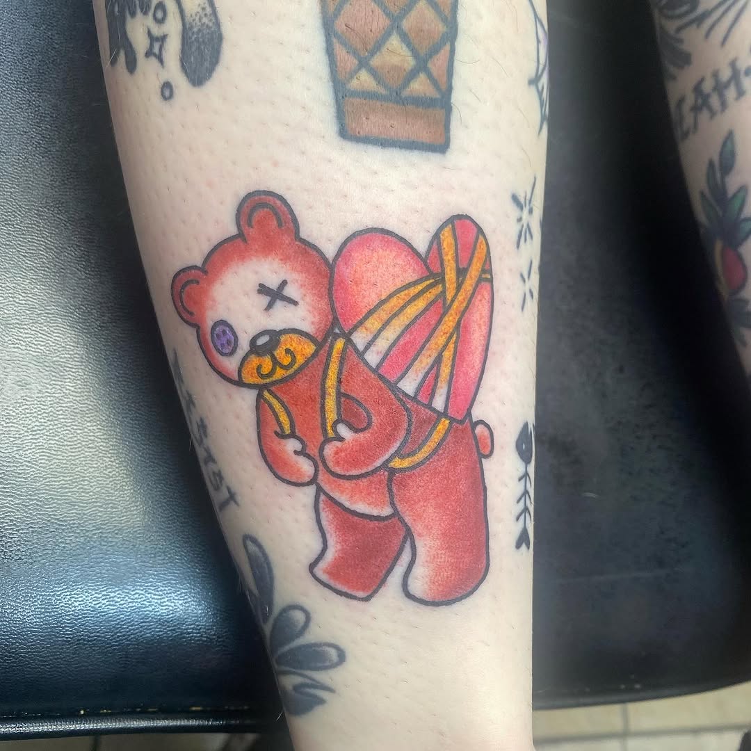 Teddy bear with heart backpack new school tattoo on the forearm by Molly Bower, Kansas City, Missouri