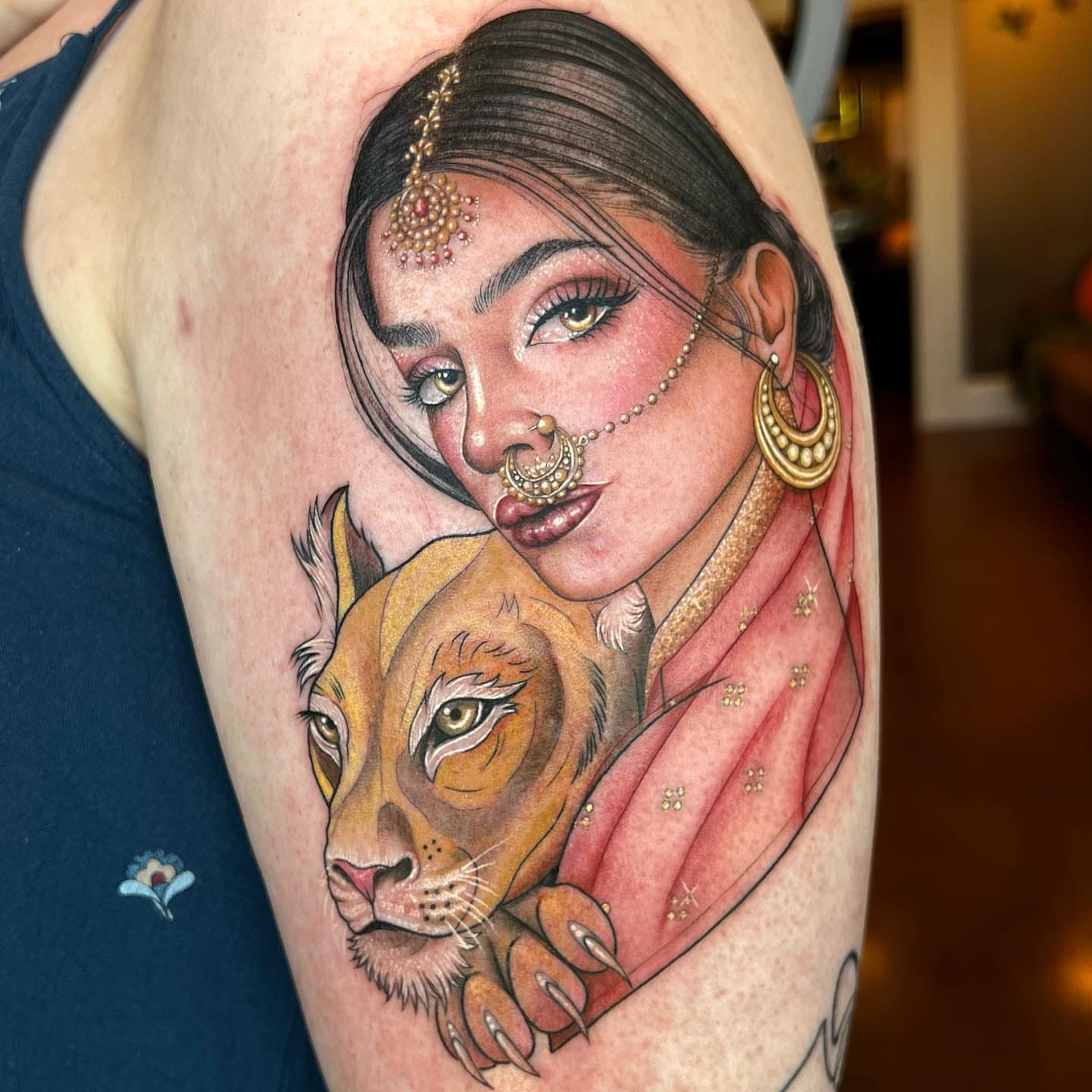 Woman with lion realism tattoo on the upper arm by ✨ Jaden Belle Tattoos ✨