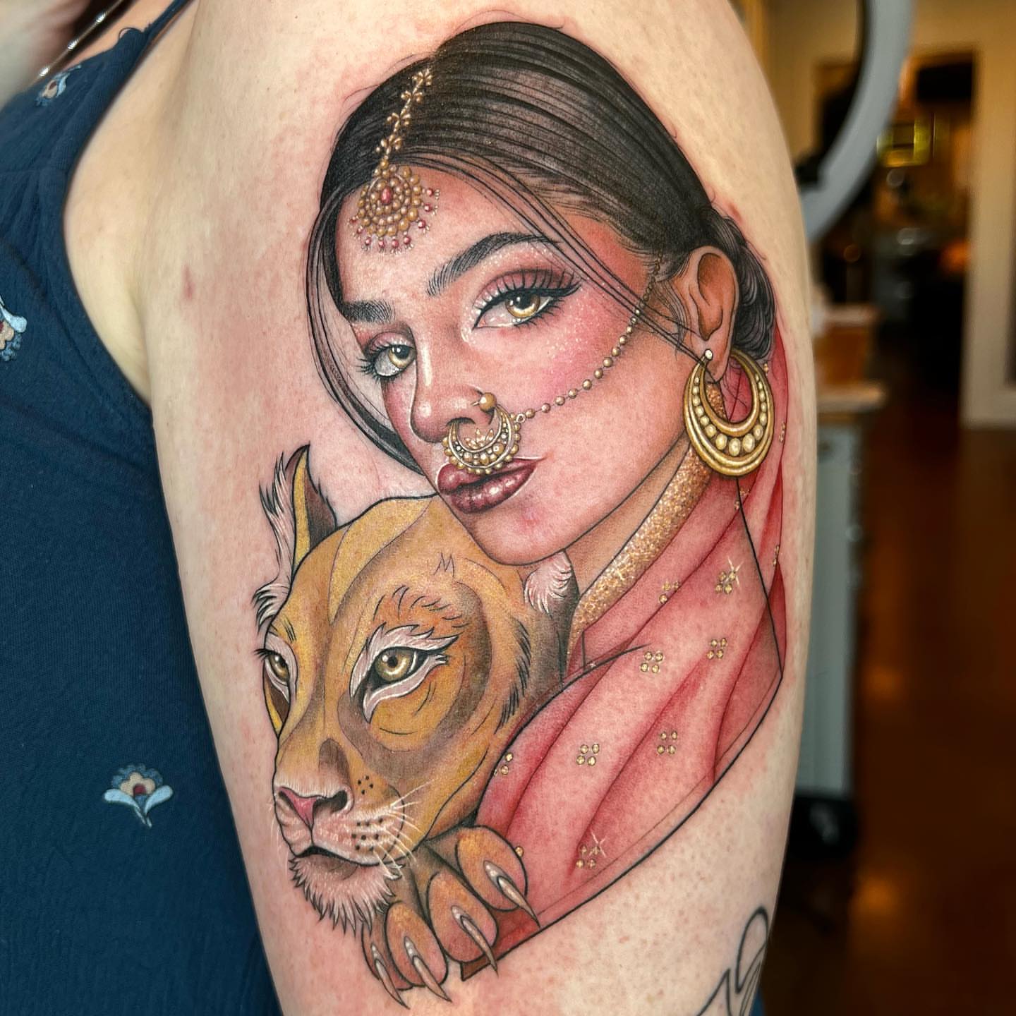Woman with lioness realism tattoo on the upper arm by ✨ Jaden Belle Tattoos ✨