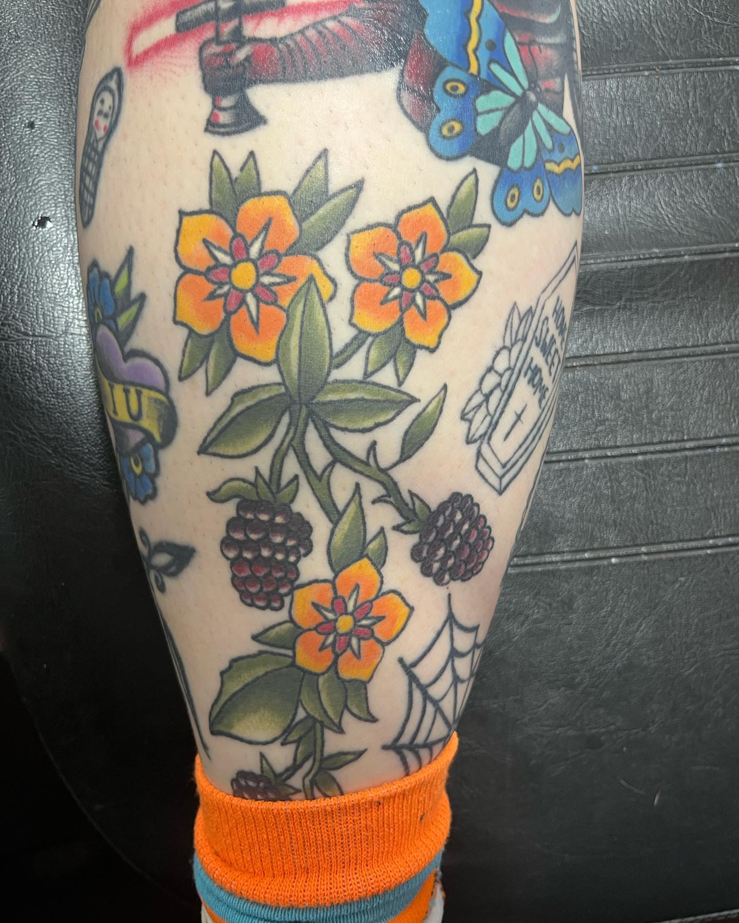 Floral bouquet American traditional tattoo on the forearm by IdleHandsFlex, New Orleans, Louisiana