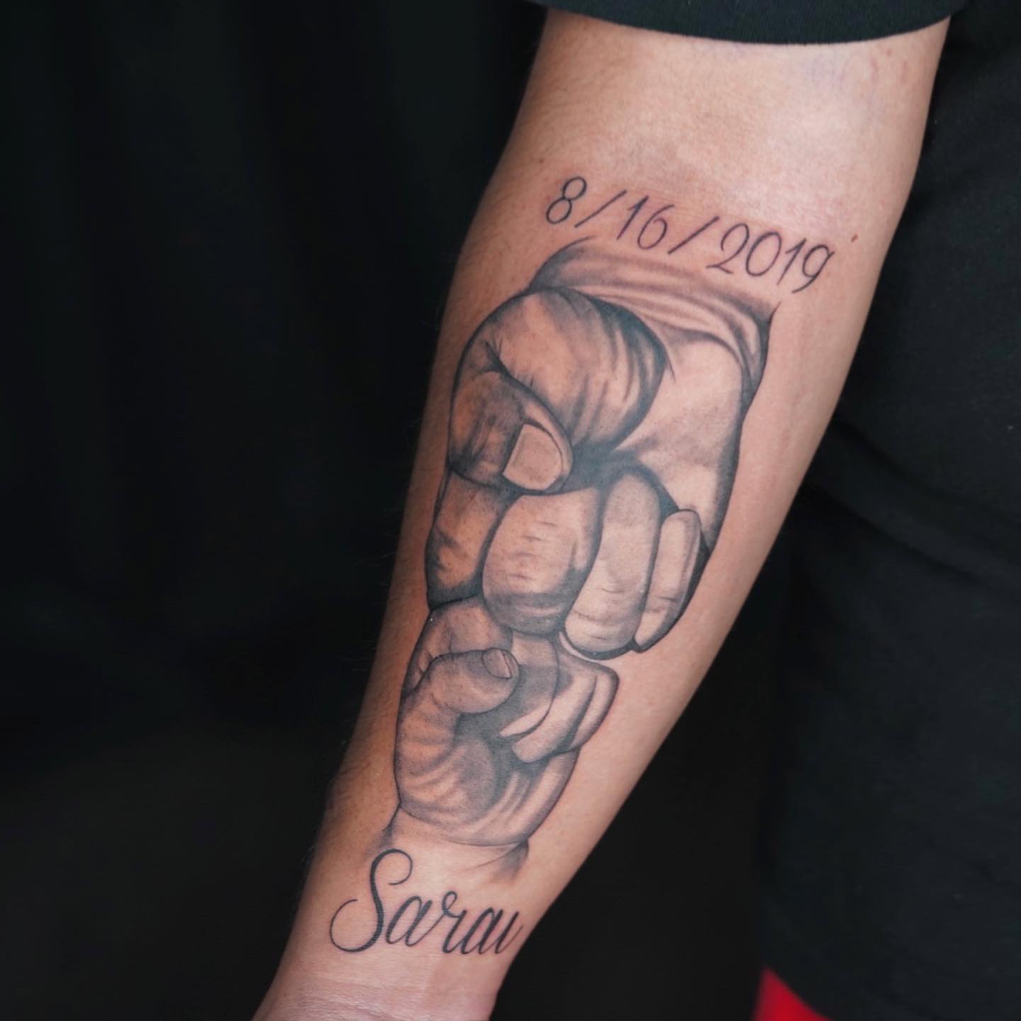 Fist holding hand realism tattoo on the forearm by Nj Tattoo Artist Inkdyou, Bloomfield, New Jersey