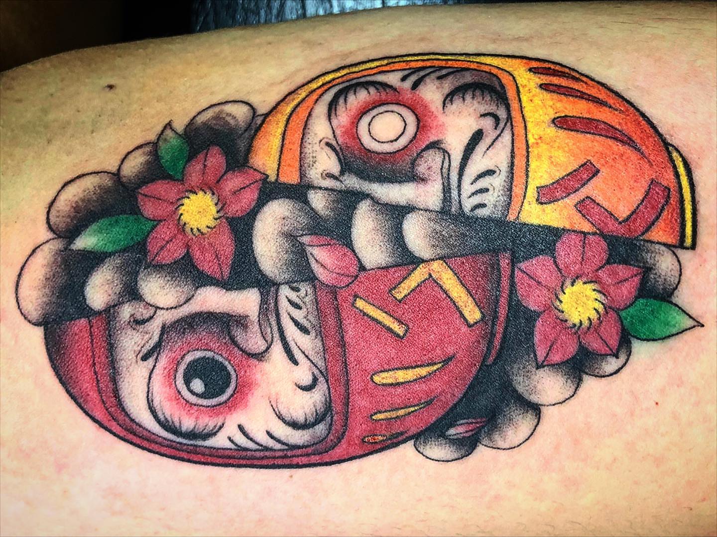 Japanese Daruma doll American traditional tattoo on the thigh by Luis Chauta